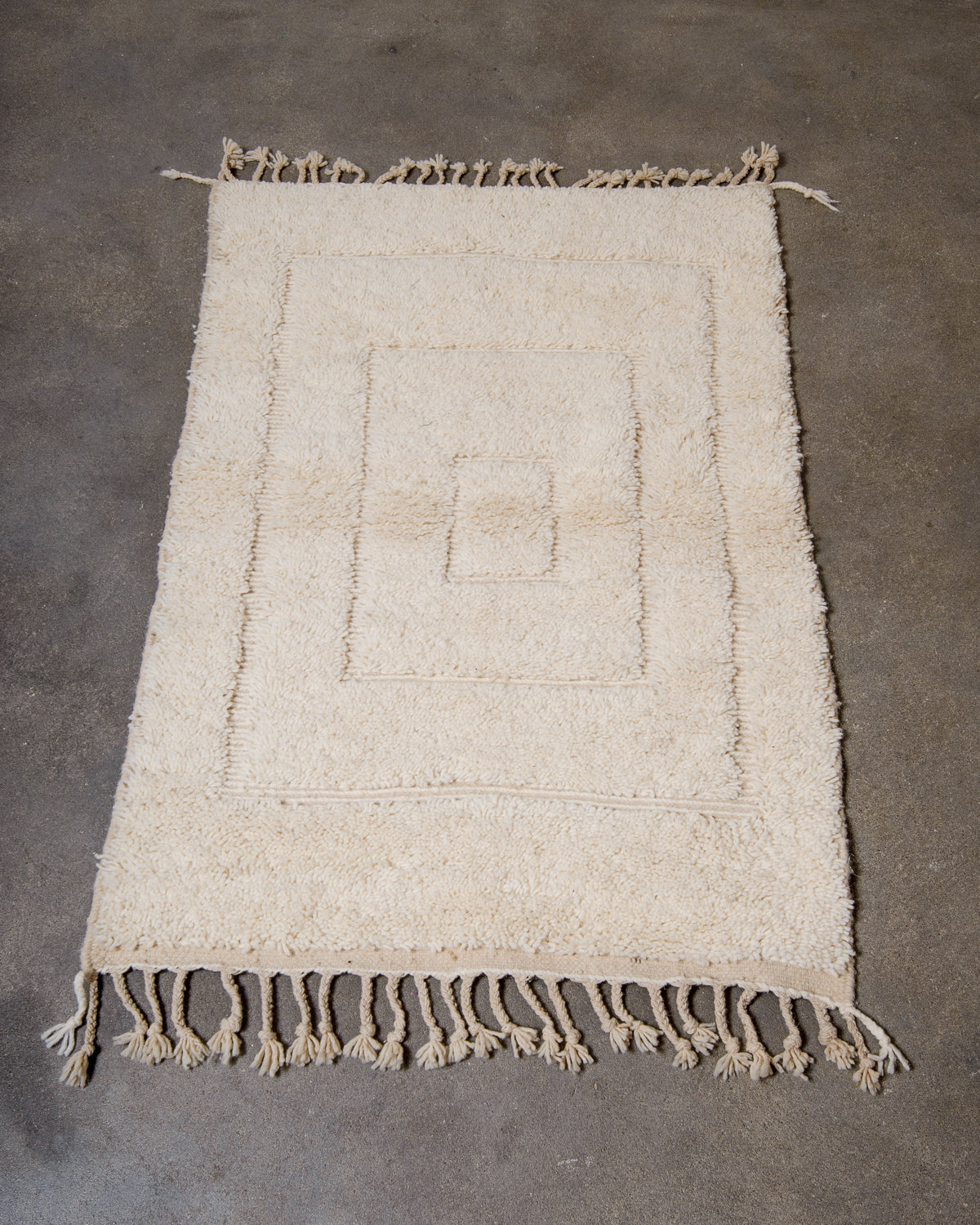 Modern, designer, handcrafted Berber rug from Morocco. Beniourain carpet with beautiful colours and patterns and fluffy wool texture.